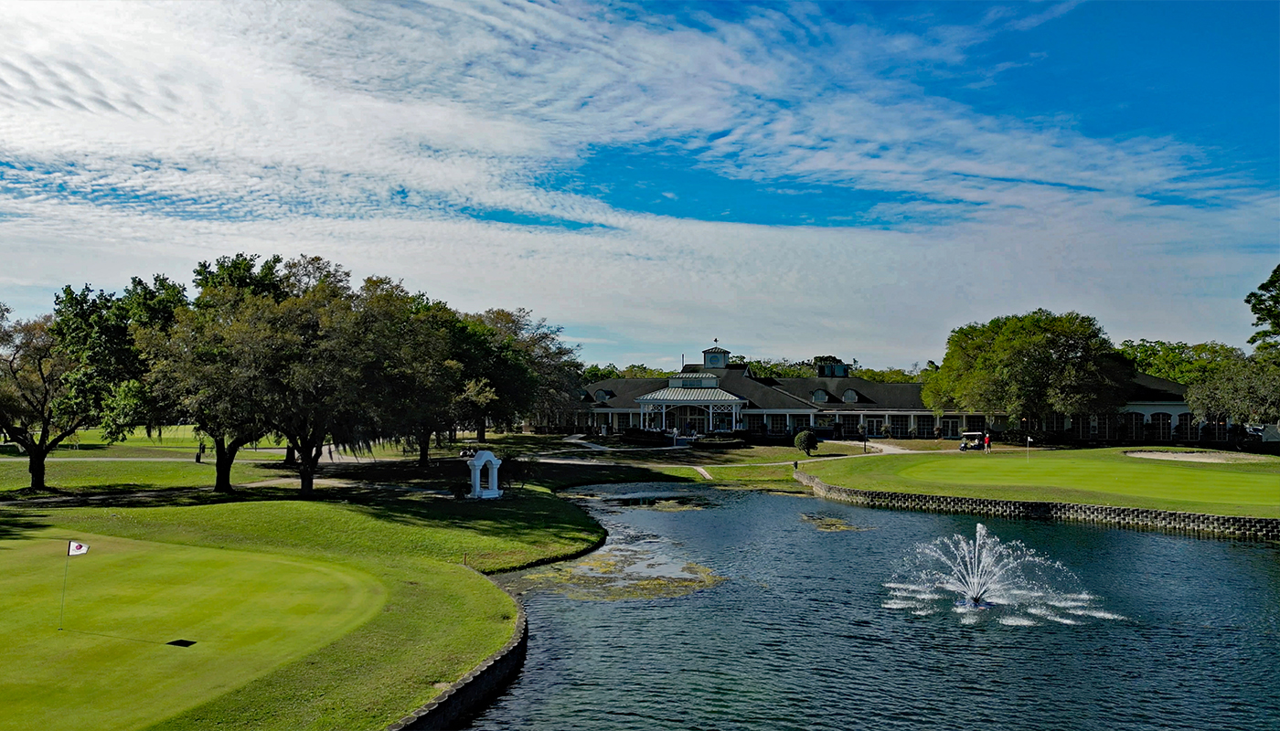 Golf  course with a pond and greens.