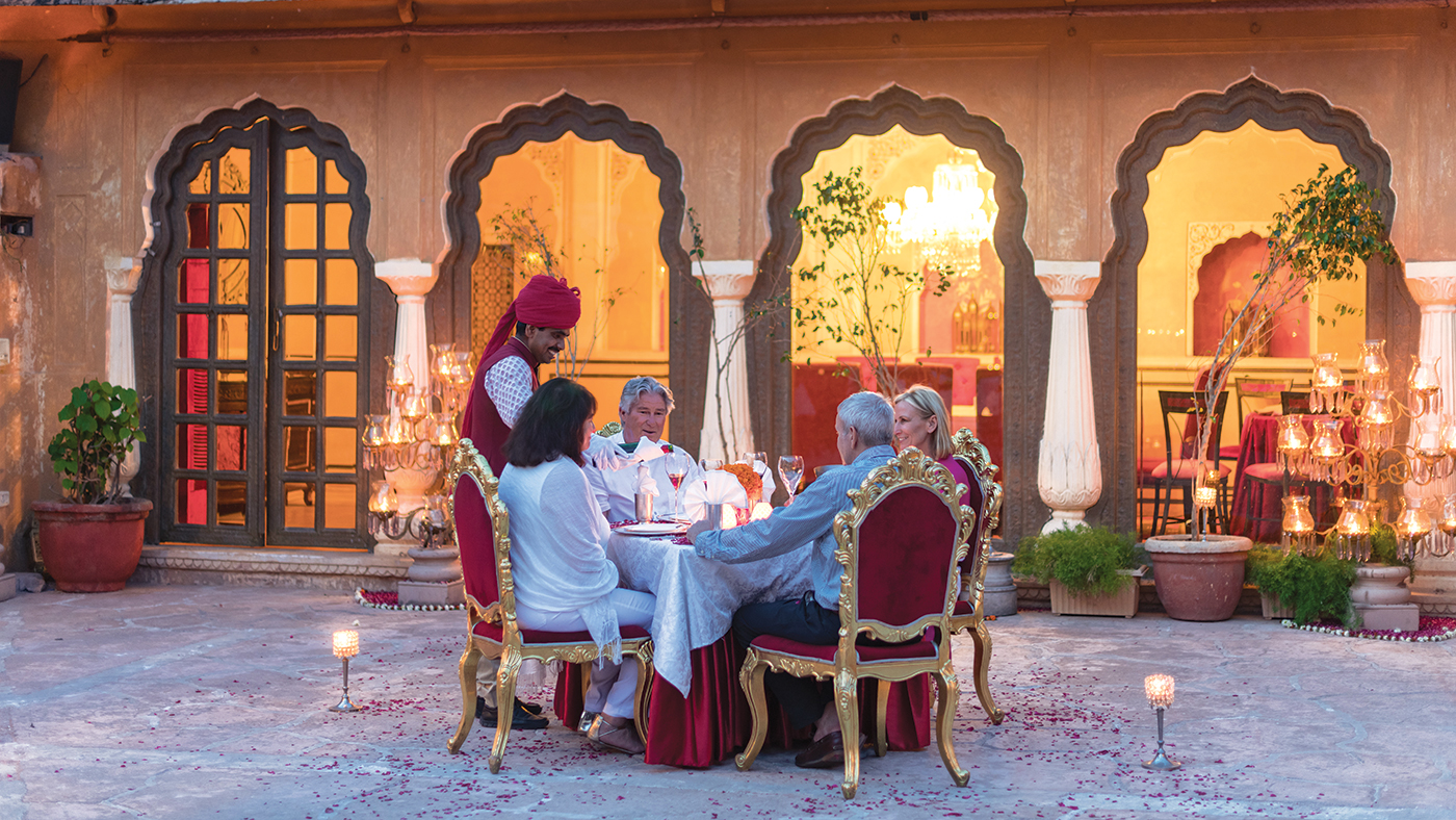 A couple dining outside in a middle eastern setting