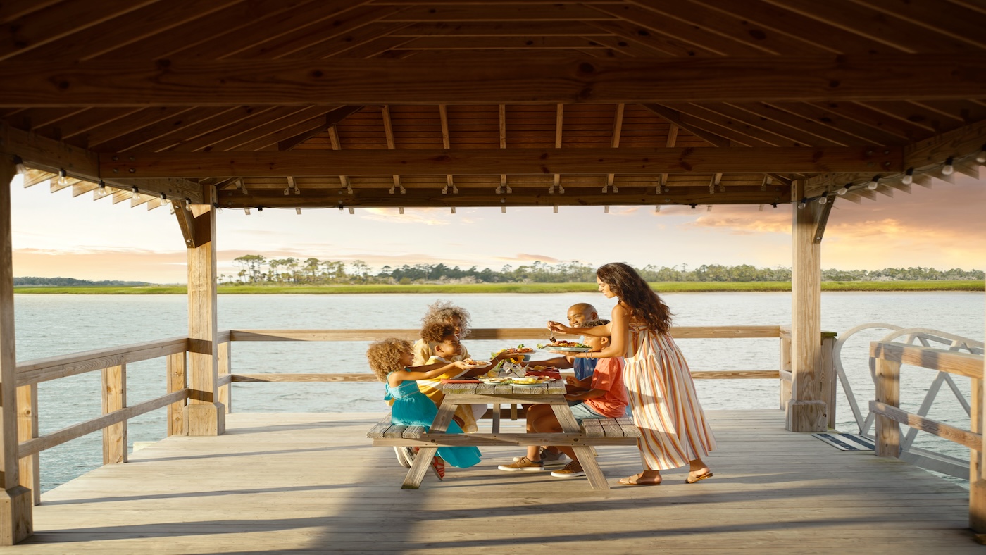 Family dining off dock on Back River - Tybee Island, GA.